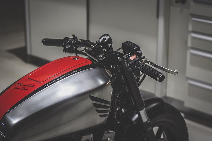 Sleek Modern Motorcycle Blends Retro and Contemporary Design in Organized Workshop Setting