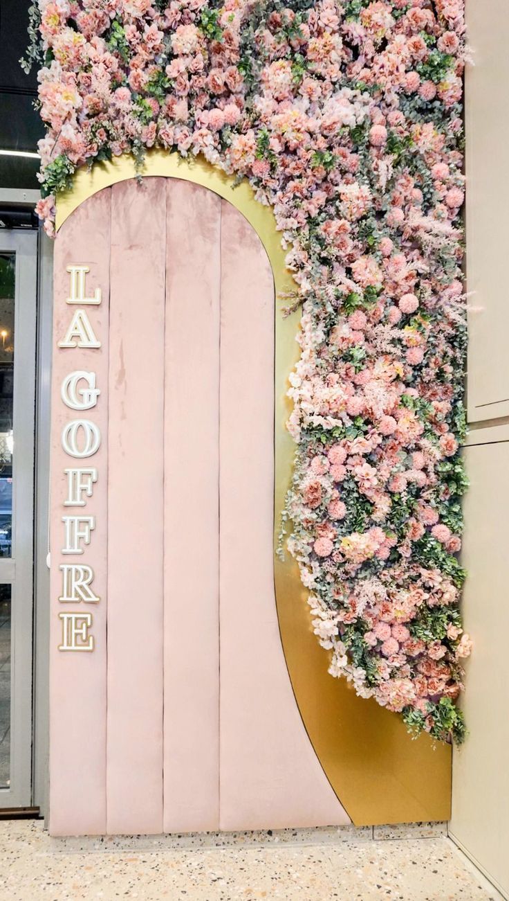 Enchanting Cafe Entrance with Elegant Floral Arch and Luxe Accents