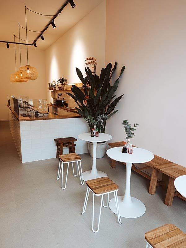 Minimalist Cafe Design: A Warm and Inviting Atmosphere with Functional Elegance