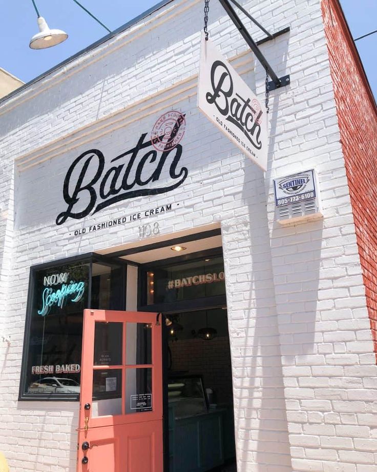 Charming Cafe Design Features Bright White Brick, Vibrant Accents, and Welcoming Atmosphere