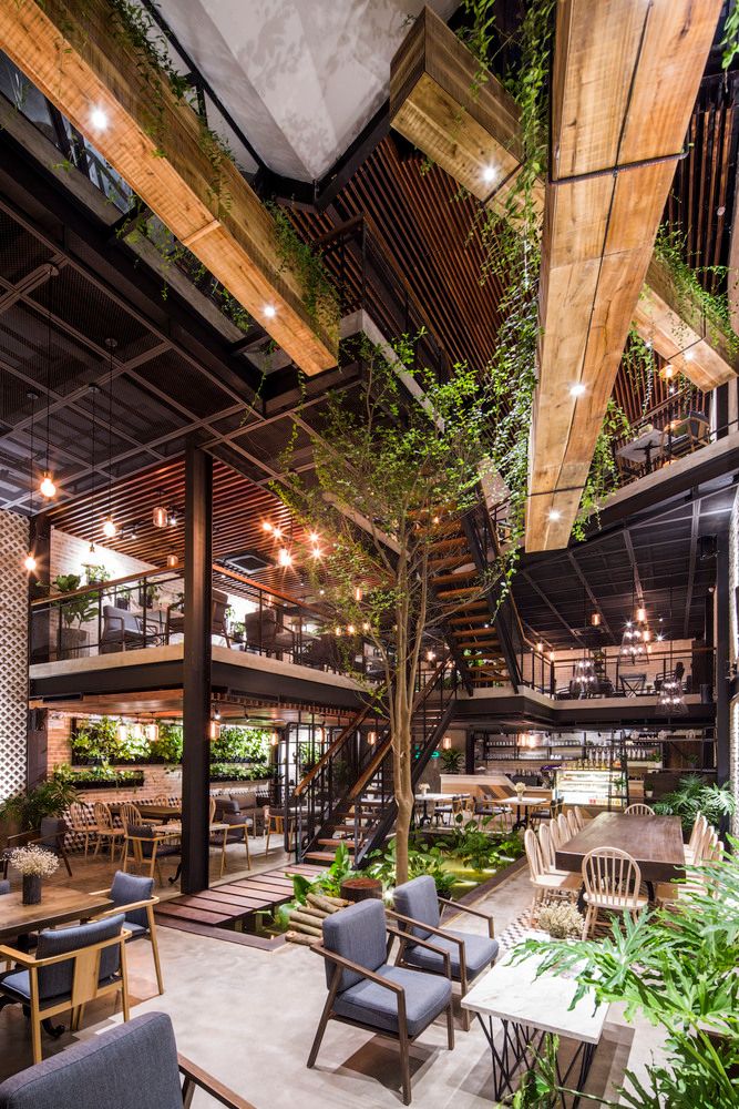 Industrial-Chic Cafe Design Blends Spacious Layout with Natural Elements for a Cozy Atmosphere