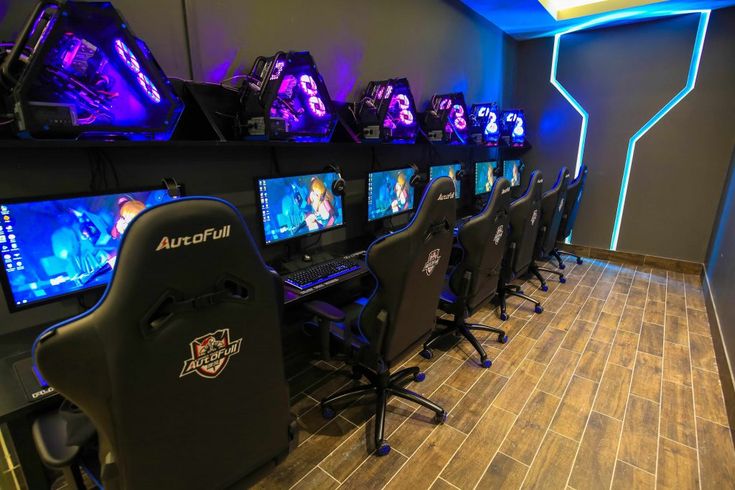 Modern Cafe Design: Immersive Gaming Environment with High-End Stations and Futuristic Aesthetic