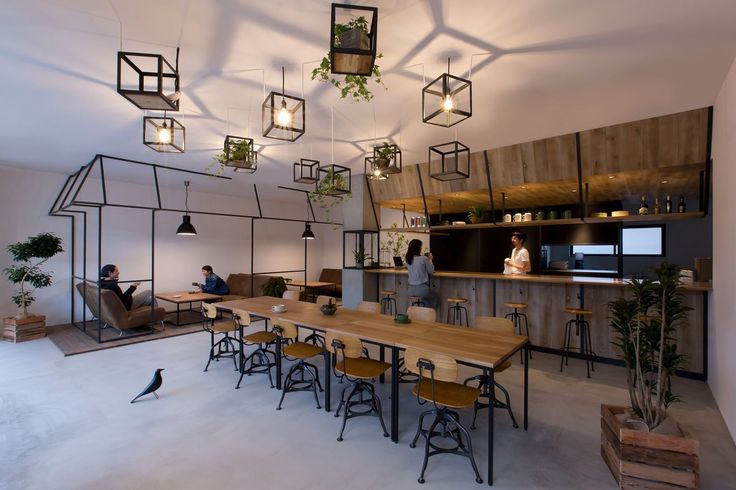 Modern Cafe Design: A Harmonious Blend of Natural Elements and Industrial Aesthetics for Social and Work Gatherings