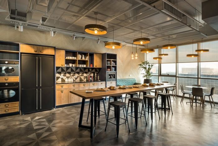 Modern Cafe Design: A Spacious, Inviting Atmosphere Blending Industrial Elements with Community Focus