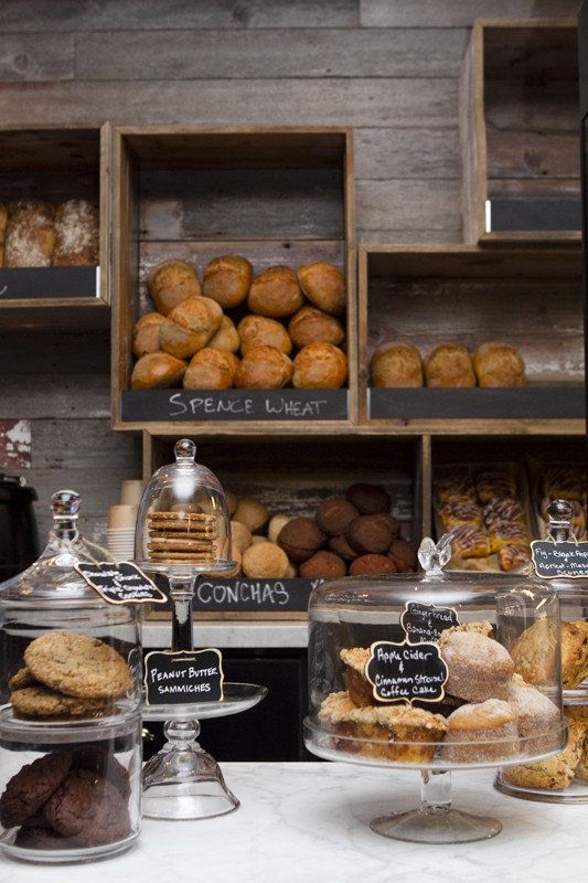 Cozy Cafe Design: Rustic Shelving and Artisanal Baked Goods Create an Inviting Atmosphere