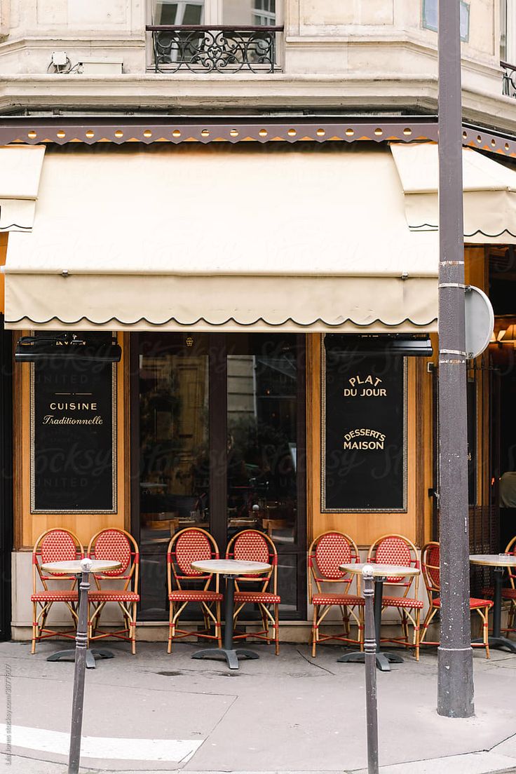 Charming Cafe Design Combines Elegance and Community Appeal with Inviting Facade and Cozy Outdoor Seating