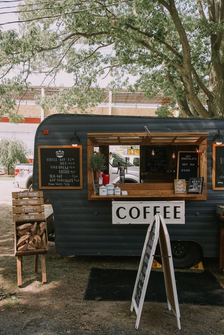 Charming Vintage-Inspired Cafe Trailer: Cozy Outdoor Atmosphere with Rustic Accents