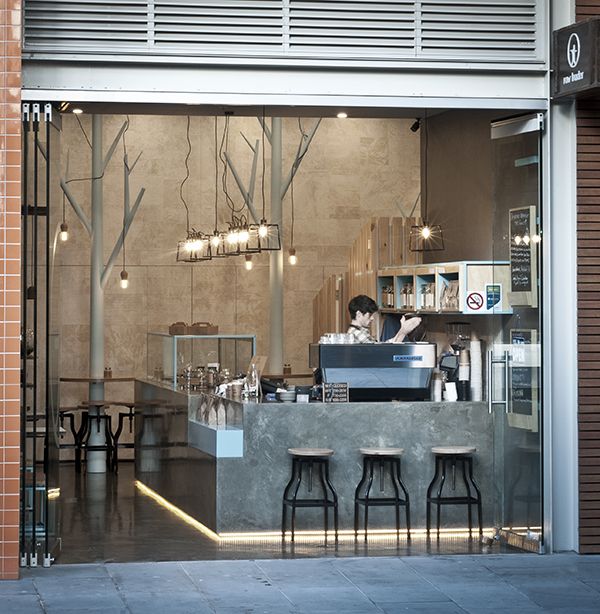 Modern Minimalist Cafe Design: A Welcoming and Elegant Atmosphere with Natural Light and Organic Touches