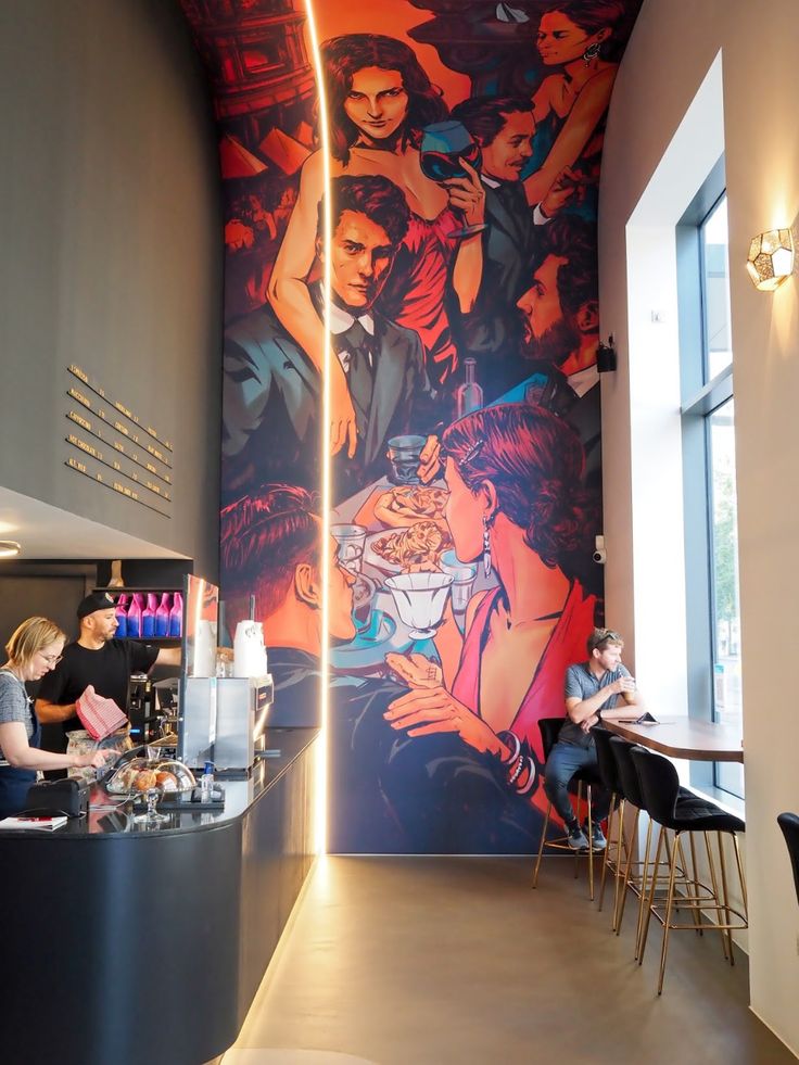 Modern Cafe Design with Artistic Mural and Inviting Atmosphere