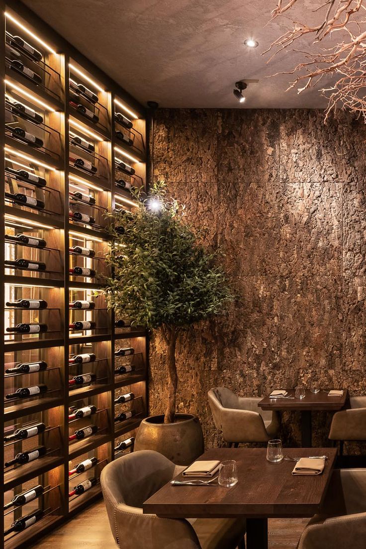 Inviting Cafe Design Features Textured Bark Wall, Elegant Wine Rack, and Cozy Ambiance