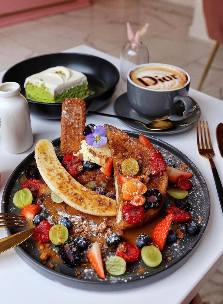 Charming Cafe Brunch: Elegant Table Setting with French Toast, Fresh Fruits, and Artistic Coffee