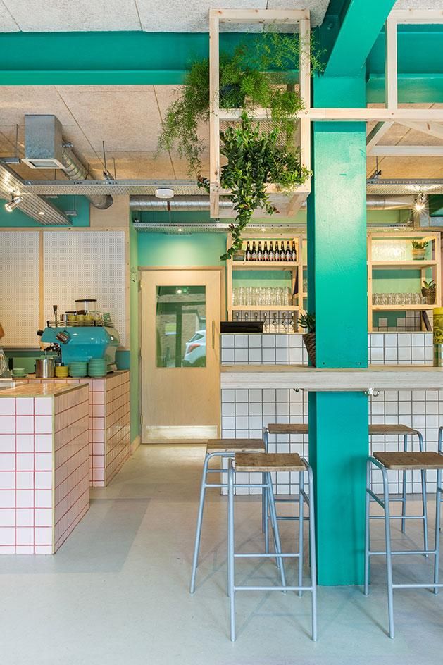 Vibrant Contemporary Cafe Design with Bold Accents and Natural Elements