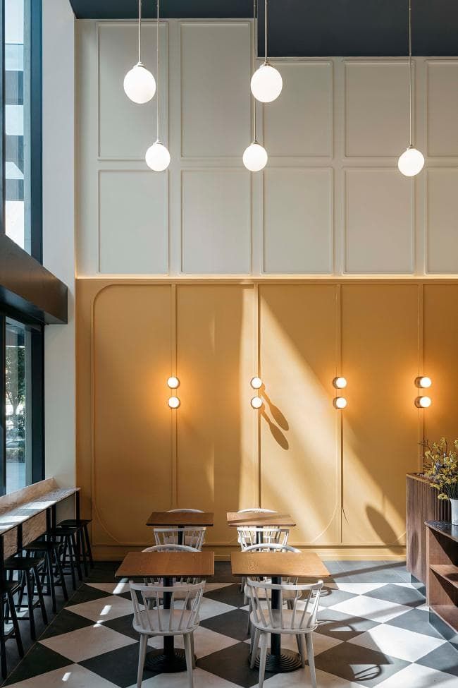 Cafe Design: A Modern, Warm Ambiance with Muted Tones and Bold Accents