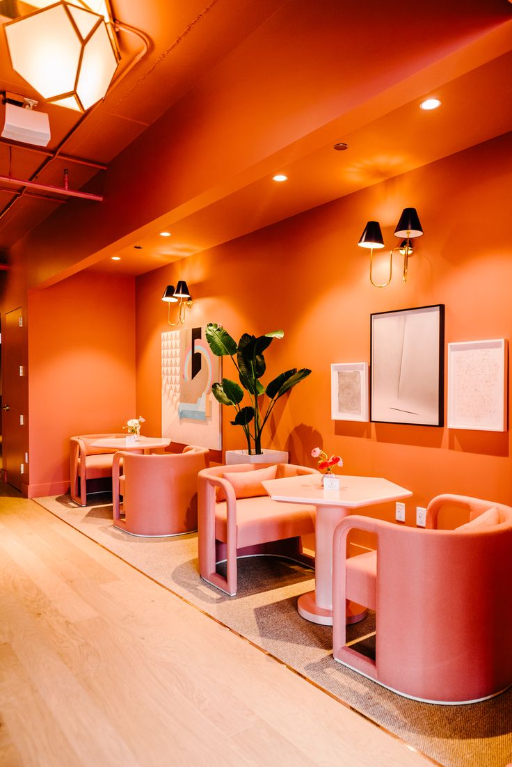 Trendy Cafe Design Combines Warm Colors, Unique Seating, and Inviting Ambiance