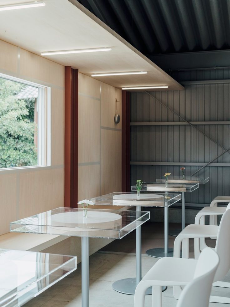 Minimalist Cafe Design Emphasizing Transparency and Tranquility