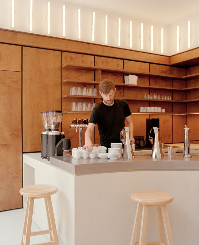 Modern Minimalist Cafe Design: Warm Wood, Streamlined Functionality, and Relaxing Atmosphere