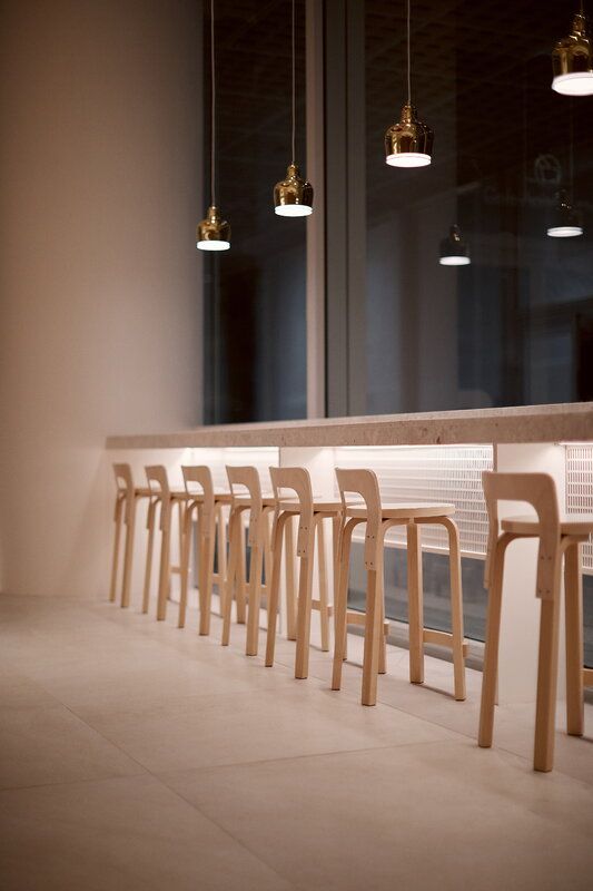 Modern Minimalist Cafe Design: Inviting Atmosphere with Natural Light and Elegant Touches