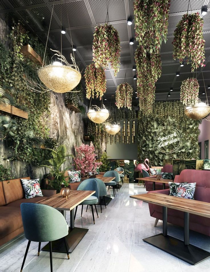 Lush Cafe Design: A Serene Garden Atmosphere with Elegant Lighting and Inviting Seating