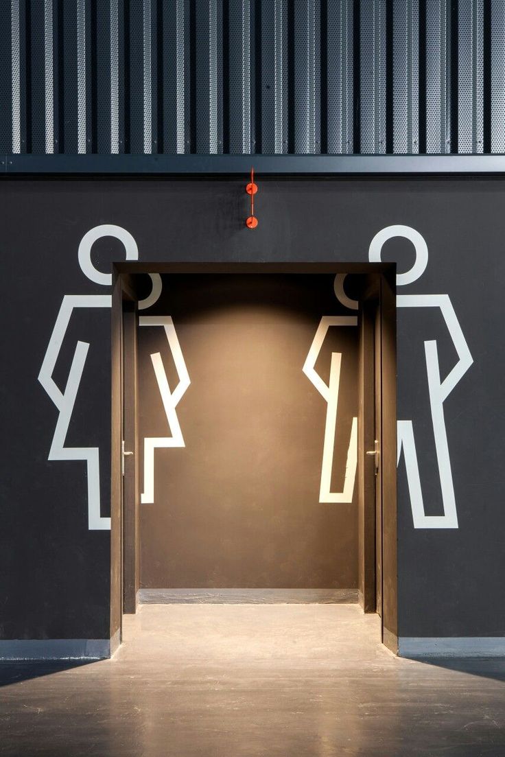 Modern Cafe Signage: Minimalist Restroom Design with Striking Visual Elements