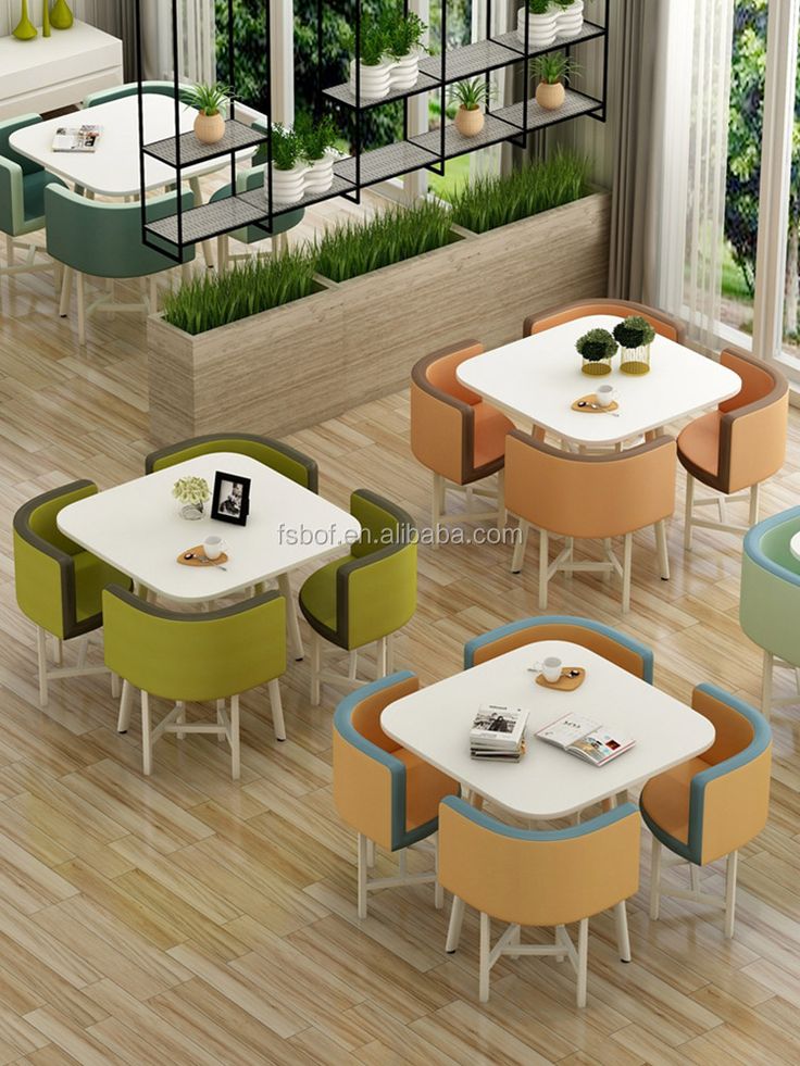 Modern Cafe Design with Colorful Seating, Natural Light, and Inviting Atmosphere