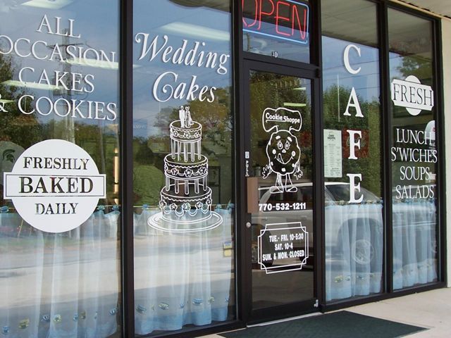 Charming Cafe with Inviting Storefront Showcasing Whimsical Treats and Cozy Ambiance