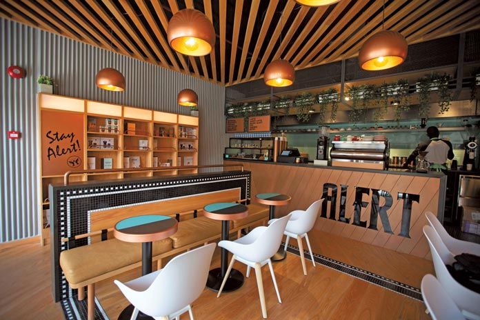 Modern Cafe Design: Inviting Aesthetic with Warm Accents and Comfortable Social Atmosphere