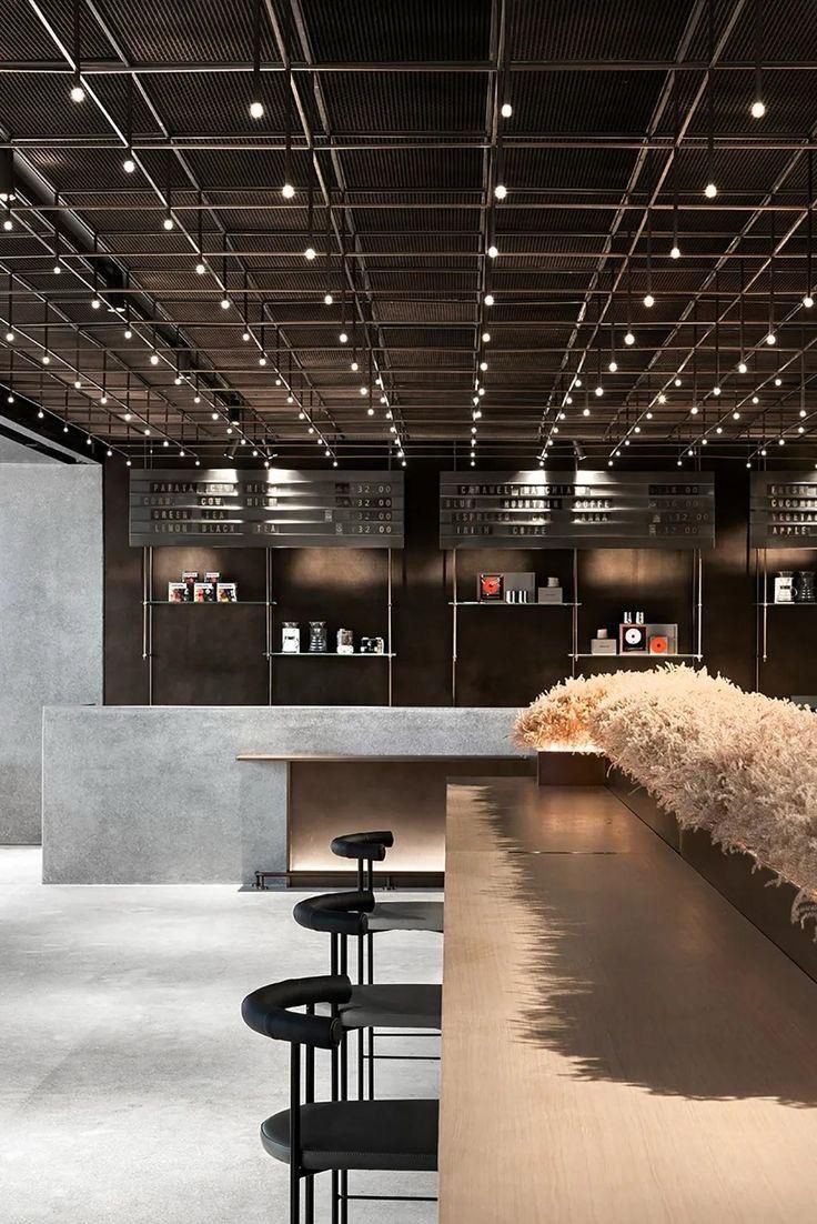 Modern Minimalist Cafe Design: A Striking Blend of Industrial and Organic Elements