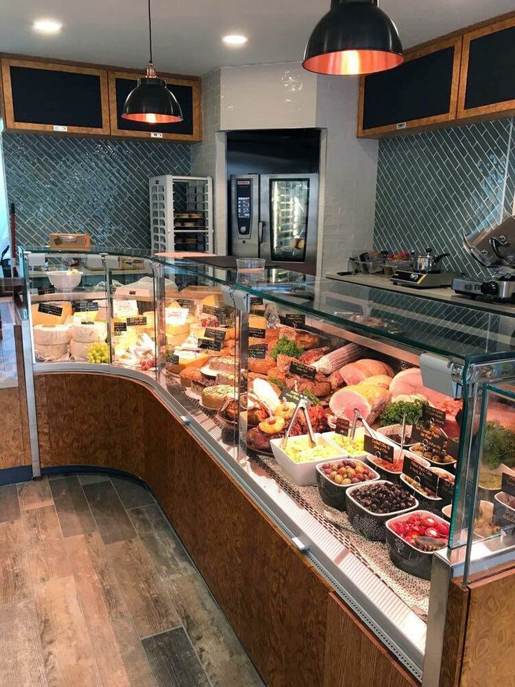 Inviting Cafe Design Blends Functionality and Aesthetics with Fresh Food Display and Warm Ambiance