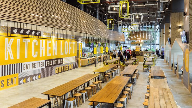 Modern Cafe Design Blending Wood and Industrial Elements for a Vibrant Social Atmosphere