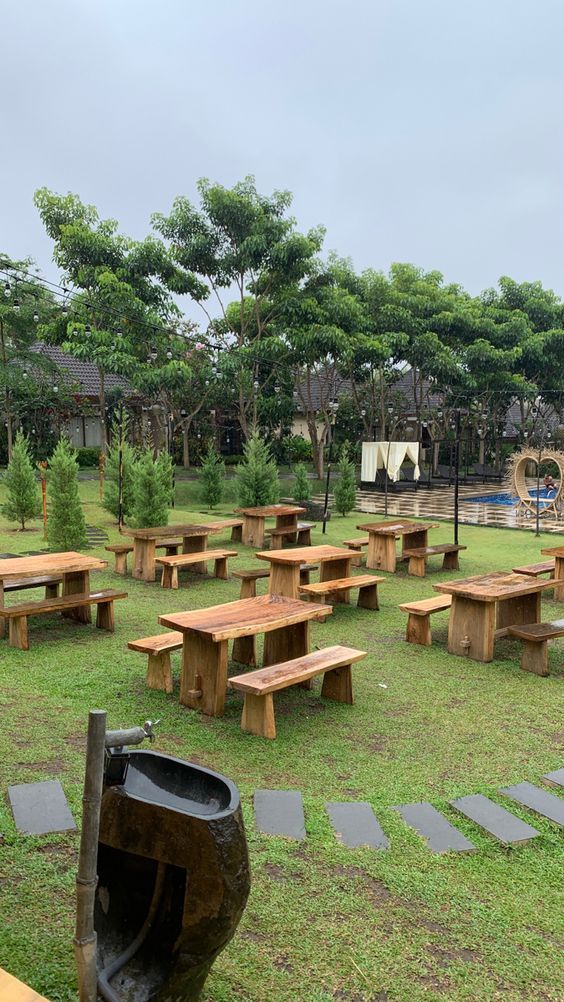 Inviting Cafe Design with Rustic Outdoor Space Surrounded by Lush Greenery for Relaxation and Socializing