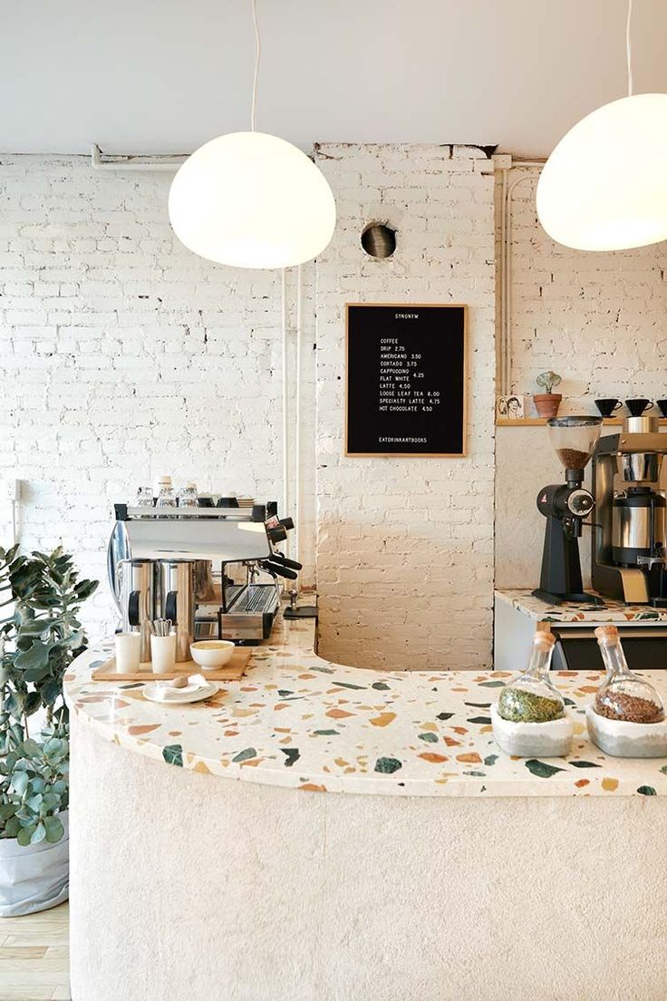 Modern Minimalist Cafe Design with Terrazzo Counter and Inviting Ambiance