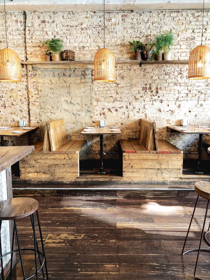 Charming Rustic Cafe: A Cozy Retreat with Exposed Brick, Repurposed Wood, and Natural Elements