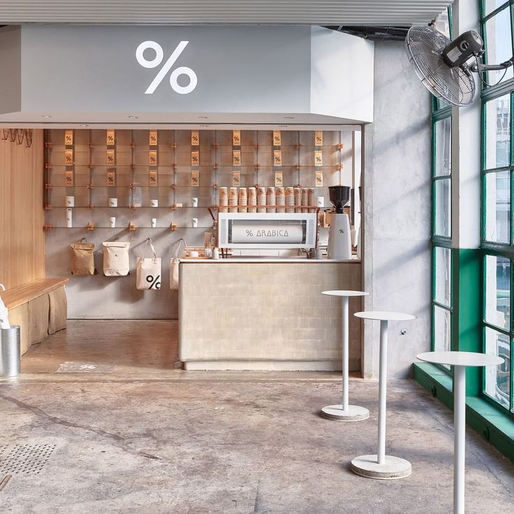 Inviting Minimalist Cafe Design Blends Natural and Industrial Elements for a Modern Atmosphere