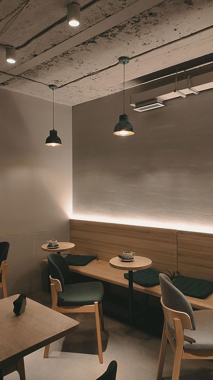 Minimalist Cafe Design Balances Industrial Aesthetics with Cozy Ambiance