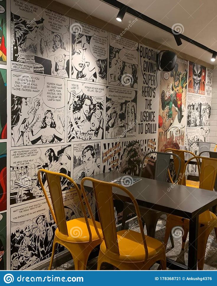 Vibrant Cafe Design Blends Comic Art and Modern Furnishings for a Dynamic Atmosphere