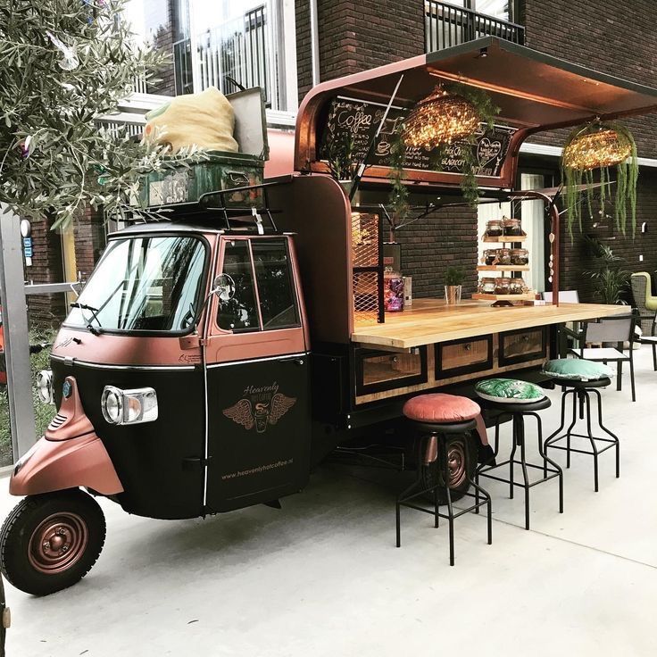 Charming Cafe Design with a Converted Three-Wheeled Vehicle in Rustic Copper and Black