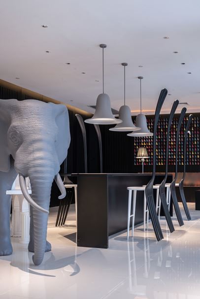 Modern Cafe Design with Artistic Sculptural Focal Point and Chic Aesthetics