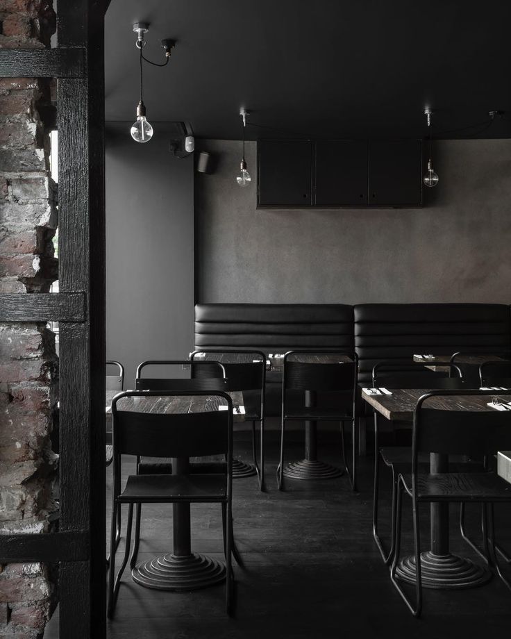 Moody Minimalist Cafe Design with Natural Textures and Intimate Lighting