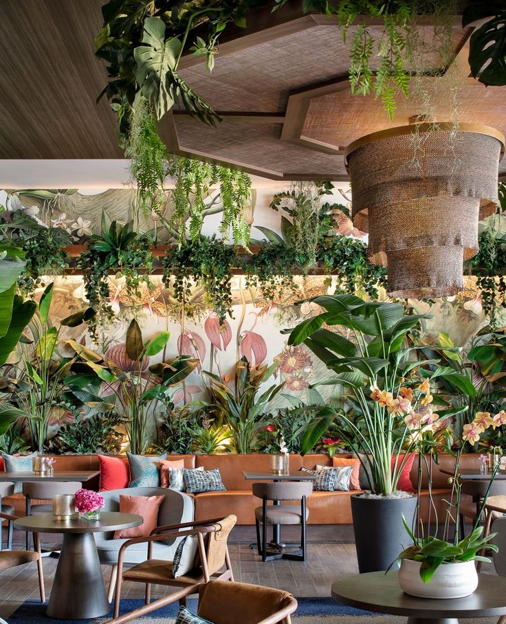 Tropical-Inspired Cafe Design Enhances Serenity with Lush Greenery and Cozy Ambiance