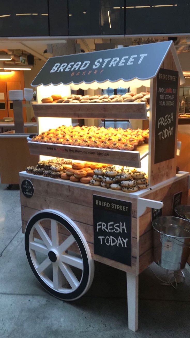 Charming Rustic Bakery Cart Enhances Cafe Atmosphere with Practical Design and Inviting Aesthetics