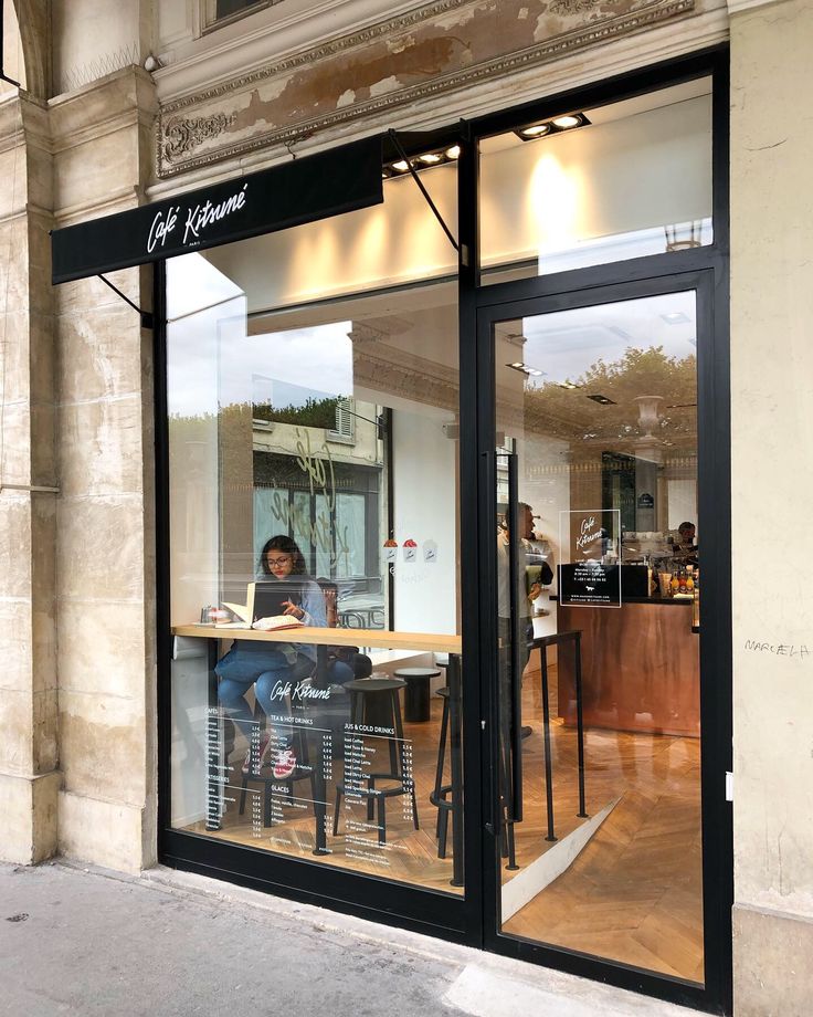 Modern Cafe Design with Inviting Atmosphere and Ambient Connection to the Outside