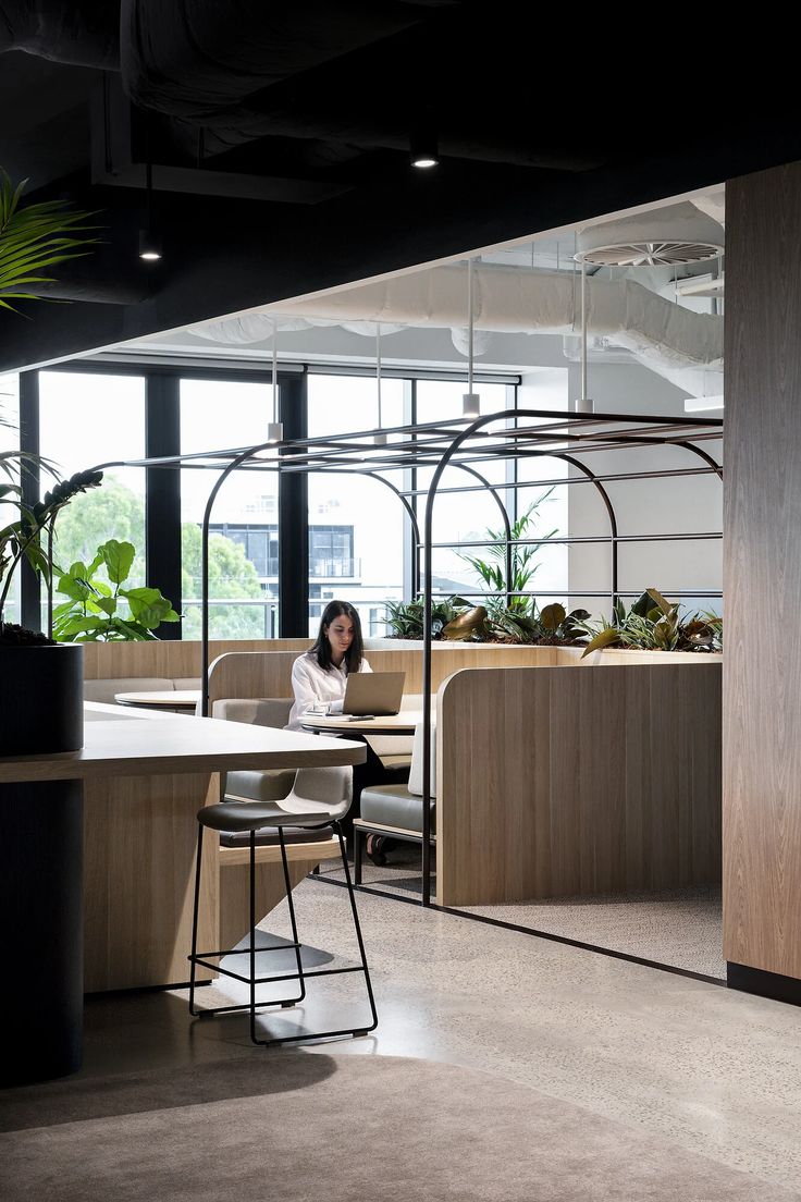 Modern Cafe Design: A Harmonious Blend of Nature and Sleek Aesthetics for Relaxation and Productivity