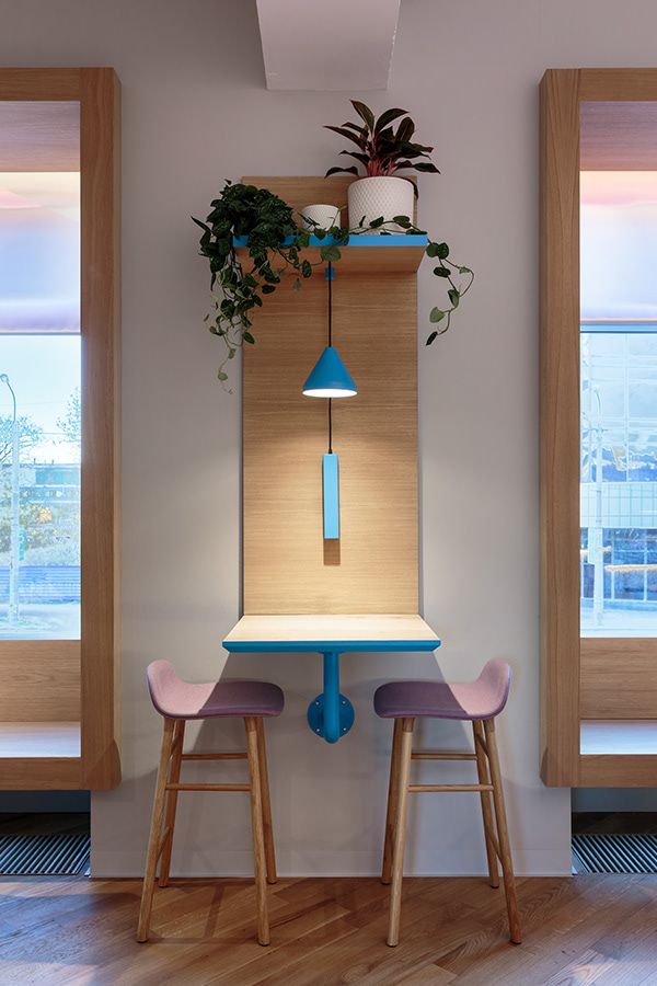 Cozy Cafe Nook with Warm Wood, Blue Accents, and Natural Light