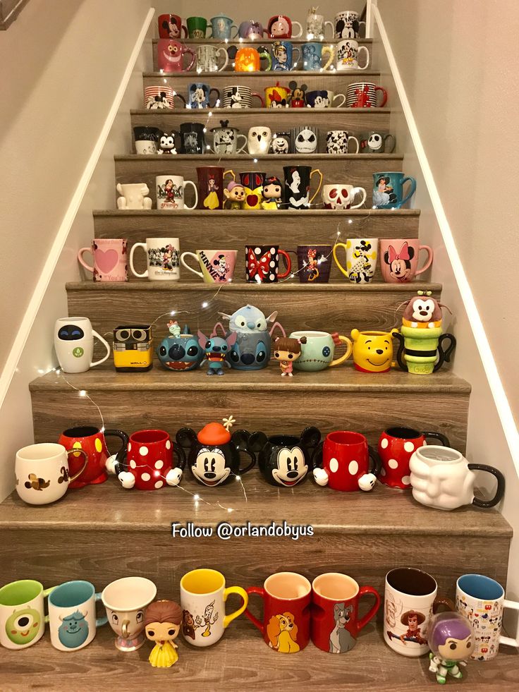 Whimsical Cafe Design: Colorful Character-Themed Mugs Creatively Arranged on a Staircase, Fostering a Cozy Atmosphere