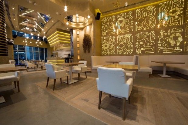 Modern Cafe Design: A Spacious, Elegant Space with Inviting Ambiance and Unique Artwork