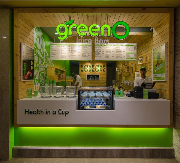 Inviting Cafe Design Showcases Health and Vitality with Vibrant Green Palette and Organic Elements