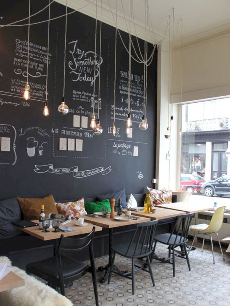 Cozy Cafe Design Blends Artistic Elements with Inviting Atmosphere for Social and Productive Visits