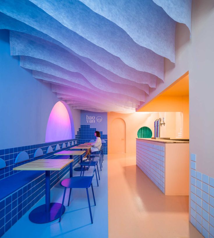 Cafe's Striking Design Offers Vibrant Atmosphere and Inviting Comfort for Patrons