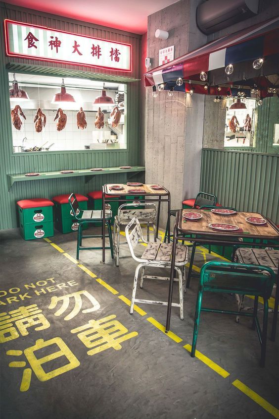 A Contemporary Cafe Blending Industrial and Vibrant Aesthetics with Playful Design Elements