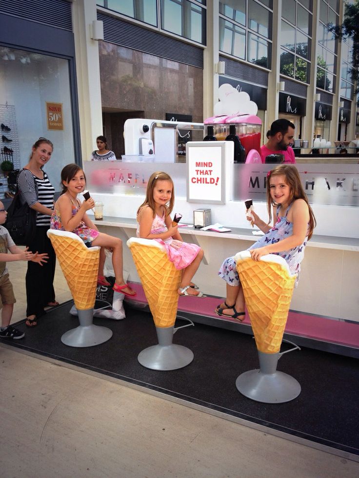 Whimsical Ice Cream Parlor Cafe Design: Oversized Cone Chairs and Cheerful Decor for a Family-Friendly Atmosphere